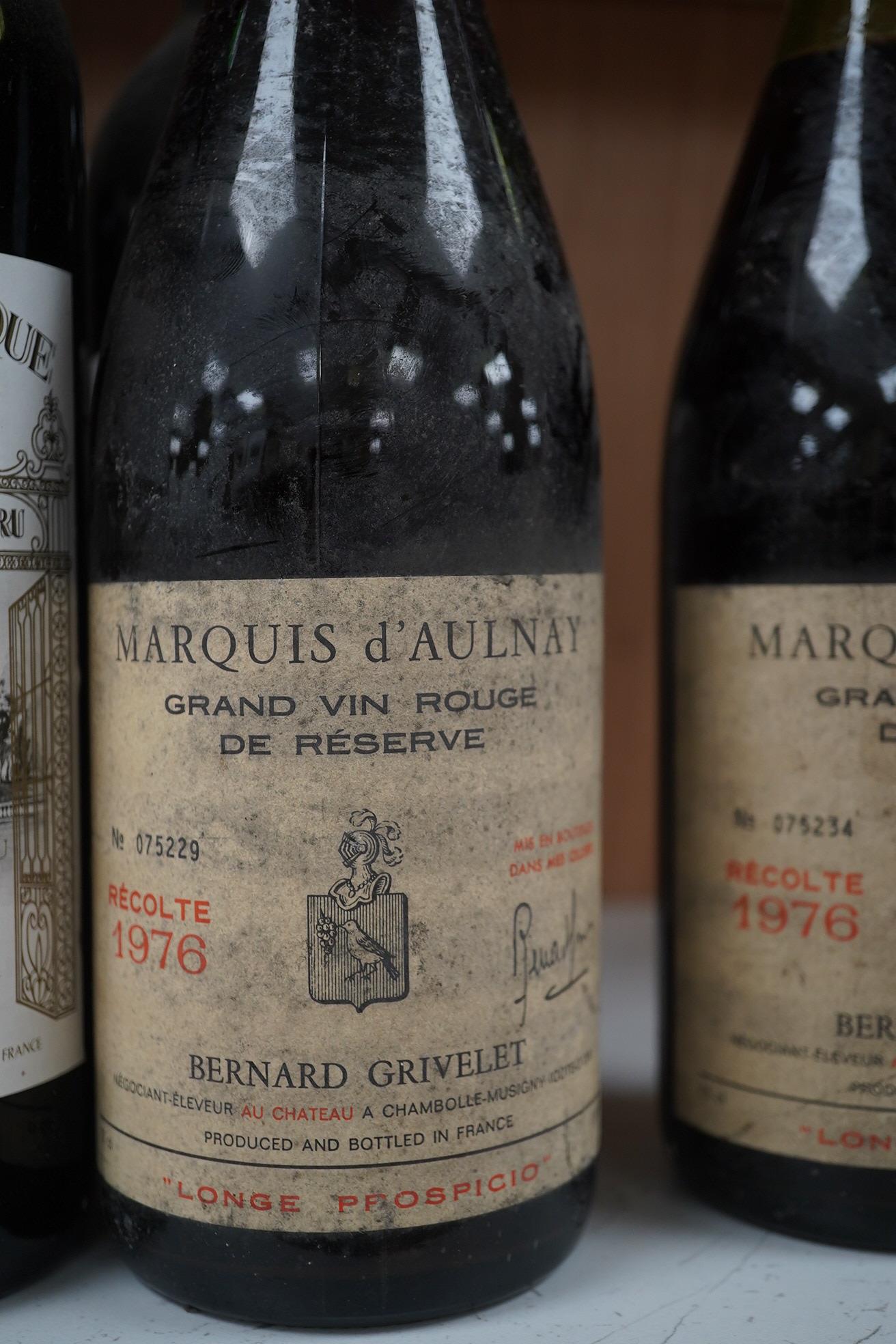 Ten bottles of French red wine to include Marquis D’Aulnay 1976 and Chateau Laroque 1986. Condition - storage unknown